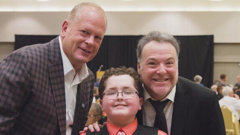 Brady Jorgensen with Council Bluffs Mayor  Matt Walsh and actor Richard Horvitz at  the 2017 Spirit of Courage event